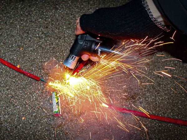 Firework lighter with blue storm flame for New Year's Eve